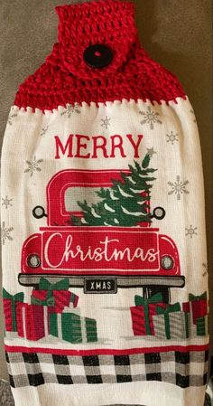 a red and white christmas sweater with a truck on it that says merry xmas