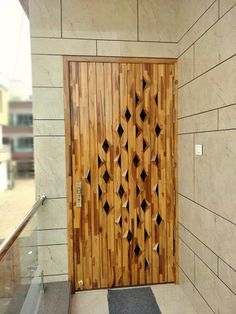 a wooden door on the side of a building