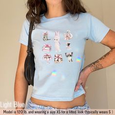 ⭐️ Get ready to fall in love with our Sonny Angel baby tee!  ⭐️ This adorable girl's best friends crop top brings back all the nostalgic vibes of retro fashion.  ⭐️ Perfect for anyone who's into that Y2K baby tee style, this retro trendy baby tshirt will give you all the feels of a classic yet trendy look.  ⭐️ Whether you're channeling your inner coquette or just want a cute graphic tee to add to your collection, this one's a must-have.  ⭐️ It's snug, stylish, and oh-so-cute--grab yours now and rock that throwback charm! ⭐️ Please note: This is a baby tee design, meant to be smaller and snug-fitting. If you prefer an adult-sized, regular fit tee, please check our other listings! 🌟 How to order 🌟 1) Choose a Tshirt size 2) Choose a Tshirt color 3) Select the quantity 4) Click "ADD TO CART