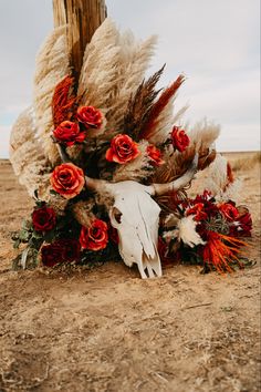 Western photography western wedding longhorn skull burnt orange florals pampas grass fake flowers Western Pampas Grass Decor, Western Wedding Burnt Orange, Western Halloween Wedding, Bull Skull Wedding Decor, Red Western Wedding Theme, Orange Western Wedding, Western Isle Decorations, Burnt Orange Country Wedding, Cow Skull Wedding Decor