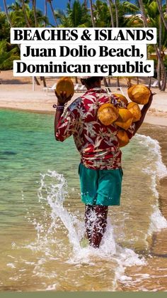 a man walking out of the ocean with coconuts on his back