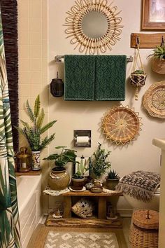 a bathroom decorated with plants and wicker baskets on the wall, along with other decor items