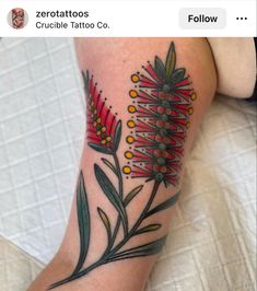 a woman's leg with flowers on it