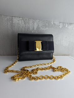 Bag size 5.5" x 4" x 2" Salvatore Ferragamo Vintage Womens Iconic Vera Bow Navy Blue Grain Caviar Leather Gold Tone Chain Crossbody Belt Waist Mini Bag Shoulder WOC Wallet Clutch Evening Purse. Detachable chain strap, can be used on waist! In very good condition.  Please see my description and pictures before bidding. I describe all items as they are and also take sufficient pictures to show you the item you will be getting. I also respond immediately to all inquiries Please do not leave negative feedback before contacting us,We will try to solve any problem that might happen. Shipping All Items shipped with tracking numbers Delivery time 15-25 Days Luxury Gold Wallet On Chain With Branded Hardware, Classic Bags With Chain Strap, Classic Bag With Chain Strap, Classic Chain Strap Bag, Classic Bag With Chain Strap As Gift, Classic Chain Strap Bag As Gift, Luxury Formal Bags With Gold Chain, Chic Evening Wallet On Chain With Metal Logo, Gold Leather Wallet On Chain