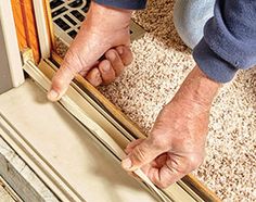 an older man is opening the door with his hands