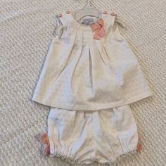 Adorable Baby Girl Outfit With Top And Matching Bloomers Materials: Top-58% Cotton, 40% Polyester, 2% Spandex/Elastane Care: Machine Wash Cool- Delicate Cycle, Wash With Like Colors. Only Non-Chlorine Bleach When Needed. Tumble Dry Low. Remove Promptly From Dryer. Medium Iron. Playful White Sets For First Birthday, Cream Sets For Playtime In Spring, Cute White First Birthday Sets, Cream Playtime Sets For Spring, Cute Cream Sets For Baptism, Cute Cream Baptism Sets, Cute Cream Baptism Set, White Sleeveless Sets For Playtime, White Sleeveless Playtime Set