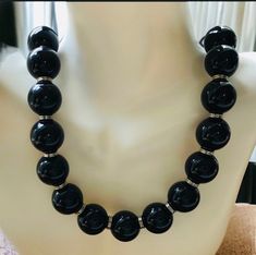 Vintage 1960's  silver and black beaded necklace.  The mid century  necklace has 2 inch black beads with alternating silver rings.  The clasp is marked gsilver or commonly called nickel silver on this 19 inch long necklace. Mint condition and comes in a gift box. Shop more of our vintage jewelry go to https://www.Etsy.com/shop/Historicallyhers Black Beaded Necklace For Formal Costume Jewelry, Formal Black Beaded Costume Jewelry Necklace, Black Beaded Costume Jewelry Necklace For Formal Occasions, Formal Black Beaded Costume Necklace, Black Round Beaded Costume Jewelry Necklace, Black Round Beads Costume Jewelry Necklace, Black Round Bead Costume Necklaces, Black Round Beads Costume Necklace, Black Beaded Necklace Costume Jewelry