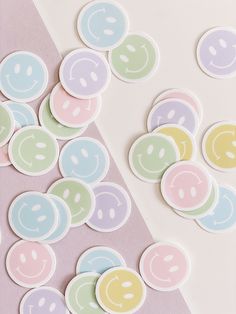 several different colored smiley face stickers next to each other