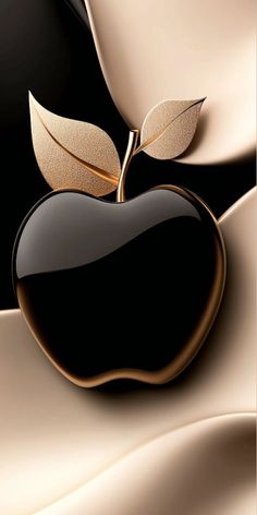 an apple with a leaf on it is shown in gold and black color palettes