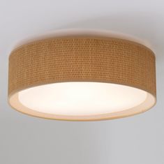 a round light fixture with woven fabric on the top and bottom, hanging from a ceiling