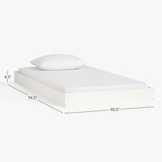 a bed with white sheets and pillows is shown next to the measurements for the mattress