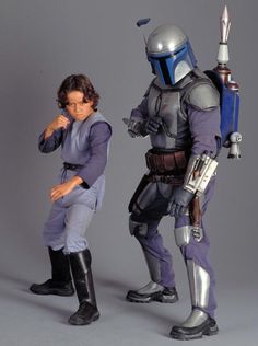 two people dressed as boba fett and star wars characters posing for the camera