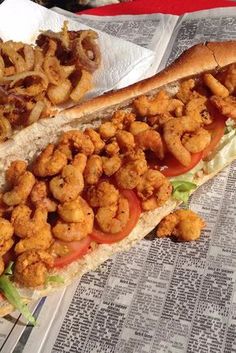 there is a sandwich with fried shrimp on it