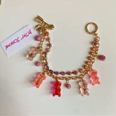 Brand New With Tags Betsey Johnson Gold-Tone Crystal & Gummy Bear Charm Bracelet Celebrate Whimsy With This Cute Crystal And Gummy Bear Betsey Johnson Charm Bracelet. Set In Gold-Tone Mixed Metal; Glass; Plastic Approx. Length: 7-1/2" Toggle Closure 1 See Matching Necklace Listing Pink Bracelet With Lobster Clasp For Party, Dopamine Jewelry, Fair Festival, Disney Charm Bracelet, Charm Necklace Diy, Betsey Johnson Bracelet, Chunky Charm Bracelet, Charm Bar, Bear Bracelet