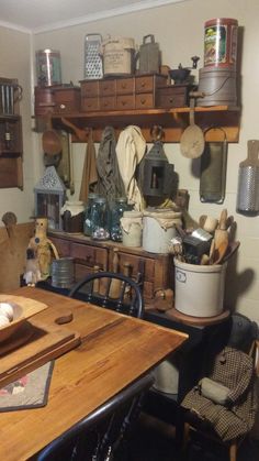 an old fashioned kitchen with lots of clutter