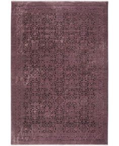 a purple rug with an intricate design on the top and bottom, in various colors