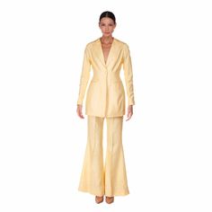 In pale yellow silk shantung, the silhouette of this single-breasted jacket is enhanced with frock-coat darts both front and back, and double welt pockets emphasising the waist. Closed with a single button on the front and with a central vent on the back. Fitted sleeves have five hand-covered buttons on the cuff. For a complete look it is ideal to wear with flared trousers in silk shantung. Slim fit Long sleeves Pockets with flap Closed with a hand-covered button Central back vent Opening on the Artisan Fashion, Frock Coat, Yellow Silk, Flared Trousers, Single Breasted Jacket, Tailored Jacket, Style Gift, Pale Yellow, Covered Buttons