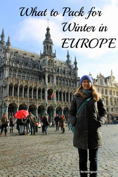 a woman standing in front of a building with the words what to pack for winter in europe