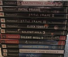 a stack of video games sitting on top of each other