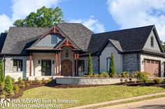 a large house with lots of windows on the front and side of it's roof