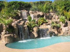 a large pool with waterfall in the middle