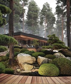 a house in the woods surrounded by rocks and trees