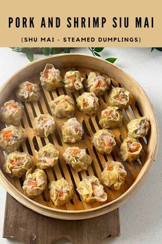 some dumplings are sitting in a pan on a wooden board with the words pork and shrimp su mau