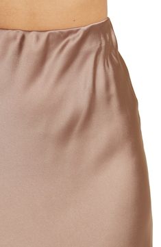 Elevate your wardrobe with this pull-on bias satin midi skirt for elegant, feminine style. 31" length (size S) Elasticized waist Pull-on style Satin construction 97% polyester, 3% spandex Machine wash cold, line dry Made in USA Model’s stats for sizing: 5’10” height, 34” bust, 27” waist, 35” hips. Model is wearing size S. Feminine Satin Lined Skirt, Silk Midi Skirt With Bias Cut, Silk Bias Cut Midi Skirt, Stretch Satin Midi Skirt, Satin Stretch Midi Skirt, Elegant Stretch Bottoms With Satin Finish, Silk Bottoms With Satin Finish For Spring, Spring Silk Bottoms With Satin Finish, Spring Satin Bottoms With Bias Cut