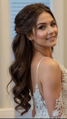 a woman with long hair wearing a wedding dress