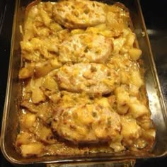 a casserole dish filled with potatoes and meat