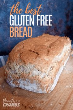 a loaf of gluten free bread sitting on top of a wooden cutting board