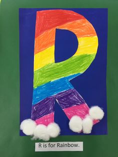 the letter r is for rainbow with pom - poms in front of it