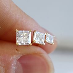 ✩ Solid 14K gold, made to last a lifetime.  ✩ Size:  3mm/4mm/5mm moissanite ✩ Carat weight: 0.18ct/0.4ct/0.75ct each x 2 ✩ Set with two high grade moissanites. Moissanite has more brilliance than natural diamonds due to its higher refractive index, and it is a 9.25 on the Mohs Scale of Hardness, suitable for everyday wear. ✩ Ship beautifully packaged More blings from Joylene: https://www.etsy.com/shop/joylenedesign Square Diamond Studs, Earrings Square, Princess Cut Moissanite, Princess Cut Gold, Mohs Scale, Square Diamond, Diamond Stud Earrings, Diamond Stud, Moissanite Diamonds