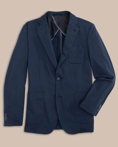 This blazer will instantly be your go-to formal coat. Lightweight and relaxed, you’ll feel polished yet comfortable all day long. Pair our navy men's blazer or khaki blazer with our Jack Pant for an elevated look. You can also pair with our Charleston Denim to provide added sophistication to a casual go-to. Fight the southern heat with built-in Coolpass technology and reduced lining for optimal breathability. Style: 7242 Classic Navy Blazer For Business Casual, Navy Classic Sport Coat With Patch Pockets, Navy Single Breasted Blazer For Business Casual, Classic Navy Sport Coat For Business Casual, Navy Business Outerwear With Patch Pockets, Classic Solid Blazer With Patch Pockets, Semi-formal Solid Blazer With Pockets, Fall Sport Coat With Welt Pockets For Business Meetings, Semi-formal Blazer With Pockets