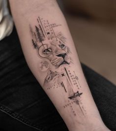 a man's arm with a lion and arrows tattoo on the left inner forearm