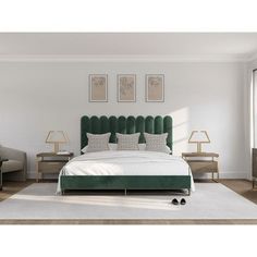 a bed with green headboard and pillows in a white room next to two lamps