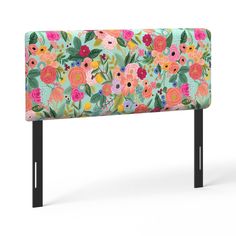 an upholstered headboard with colorful flowers on it