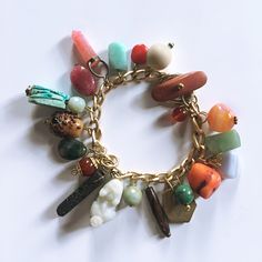 Add a touch of exotic flair to your look. As if collected over the course of a lifetime of globe trotting, the WANDERER bracelet sports a collection of stones, crystals, beads, and trinkets for a well traveled look.  Even the toggle clasp is made of wood.  Comfortably fits a 6-6.5" wrist.  And the best part is that nearly all components were upcycled from unwanted jewelry, (including a solitary J Crew earring). Stylish and sustainable.  Does it get any better? Responsibility looks good on you. Eclectic Jewelry With Natural Stones, Eclectic Natural Stone Bracelets, Unique Multicolor Charms Jewelry, Unique Multicolor Jewelry With Charms, Unique Multicolor Charm Jewelry, Unique Vintage Charm Adjustable Bracelet, Bohemian Bracelet Jewelry Souvenir, Neutral Bracelets, Travel Bracelet