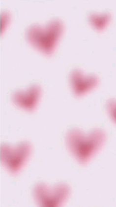 many hearts are arranged in the shape of small red hearts on a white background with pink highlights