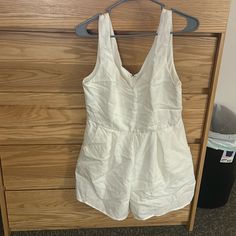 White Romper From Francesca’s. Never Worn, Still Has Tags !! White Cotton Jumpsuits And Rompers For Vacation, White Cotton V-neck Jumpsuits And Rompers, White Cotton V-neck Jumpsuit, White Jumpsuits And Rompers With Pockets For Day Out, White V-neck Jumpsuits And Rompers For Daywear, White V-neck Jumpsuits For Daywear, Blue Rain, Rain Pants, White Romper