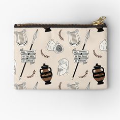 a white zipper pouch with black and brown images on it, including an image of musical instruments