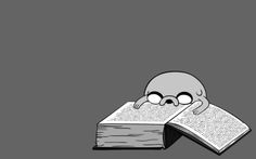 an open book with a cartoon character sleeping on it's face next to a skull