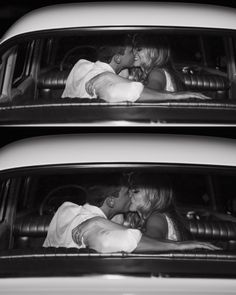 two people are kissing in the back of a car