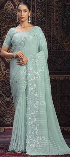 Green color Saree in Georgette fabric with Sequence, Thread, Zari work Elegant Saree For Ceremony, Elegant Saree With Pallu For Ceremony, Green Georgette Embroidered Fabric For Wedding, Elegant Embroidered Saree Fabric For Ceremonies, Elegant Dupatta Fabric For Wedding, Elegant Embroidered Saree For Ceremony, Elegant Wedding Fabric With Zari Work, White Wedding Saree Fabric, Green Fabric With Intricate Embroidery For Wedding