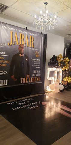 the cover of jabar magazine on display in a room with balloons and streamers