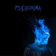 a man with blue fire on his face and the words psychdrama written above him