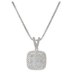 This exquisite pendant features a cushion shape design, crafted in 18KT white gold. It is adorned with 0.77 carats of round brilliant cut diamonds, with G color and VS1-VS2 clarity. The diamonds add exceptional sparkle and elegance to the piece, making it a perfect choice for special occasions or adding a touch of luxury to everyday wear. Timeless Diamond Necklace With Square Pendant, White Gold Square Pendant Diamond Necklace, White Gold Diamond Necklace With Square Pendant, Formal Diamond White Square Pendant Necklace, Classic White Diamond Square Pendant Necklace, Classic White Diamond Necklace With Square Pendant, White Gold Necklace With Cushion Cut Halo Setting, White Gold Cushion Cut Necklace With Halo Setting, Classic White Square Pendant Diamond Necklace