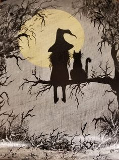 the silhouettes of two cats are sitting on a tree branch with a full moon in the background