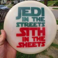 a white frisbee with red and green lettering on it that says jed in the streets