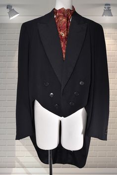 "Original vintage tailcoat from the 1940s by M G Rasmussen. Double breasted with grosgrain collar and original buttons intact, two inner pockets. In good cared for condition; there is some rubbing on the tips of the collar. It's an approximate size medium Shoulder to shoulder:  19\" Chest:  40\" Nape to the bottom of the tail:  39\" Shoulder to cuff:  26\" Please ask if you have any questions  :) Please note:  this is a used item, not new and not pristine.  My items have been in storage and may require laundering.  If there is a problem with your order please contact me straight away - I always work with my customers to try and resolve any issues. Please read the item description and measurements carefully before bidding to try and limit the wastage created by returns in terms of packaging Victorian Long Sleeve Outerwear For Formal Occasions, Victorian Long Sleeve Formal Outerwear, Victorian Style Formal Long Coat, Classic Tailored Outerwear For Costume, Victorian Formal Outerwear With Buttons, Vintage Formal Blazer With Covered Buttons, Vintage Blazer With Covered Buttons For Formal Occasions, Elegant Costume Blazer With Buttons, Vintage Black Semi-formal Outerwear